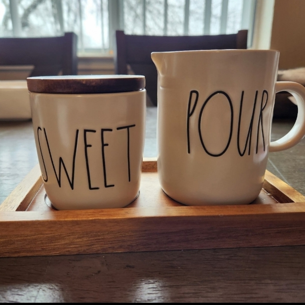 New. Never used. Rae Dunn Sweet/Pour Cream & Sugar set. Wood base.